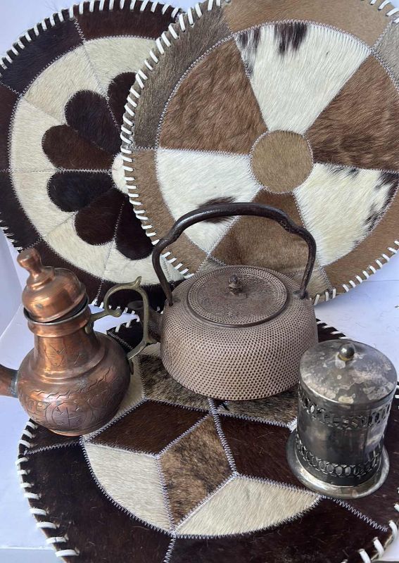 Photo 1 of VINTAGE ASSORTMENT LEATHER AND PLACEMATS, COPPER TEAPOT, CLAY TEAPOT AND SILVER PLATE