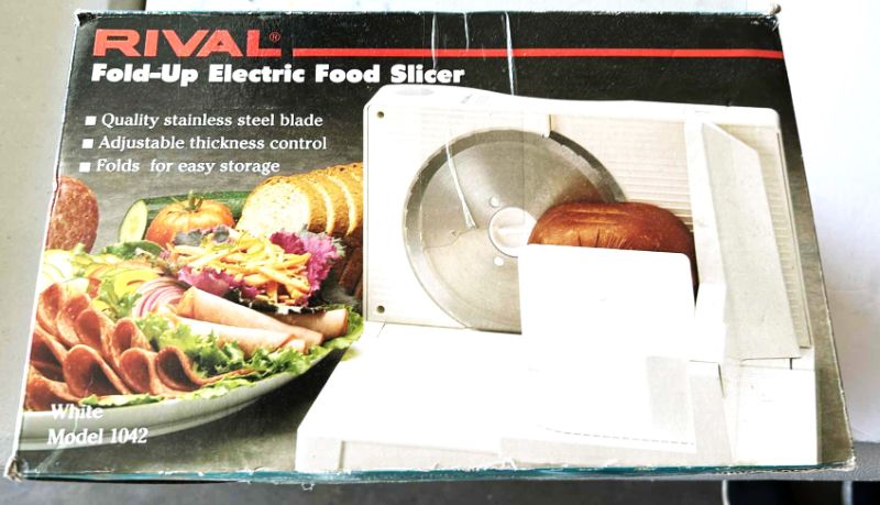 Photo 1 of RIVAL FOLD UP ELECTRIC FOOD SLICER