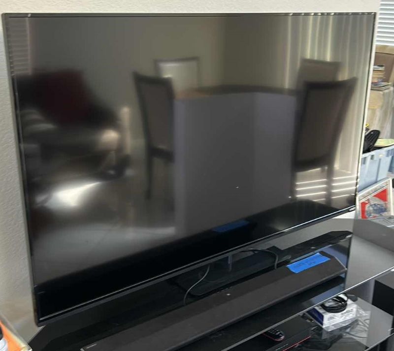 Photo 1 of 59” VIZIO FLAT SCREEN TV W REMOTE (ONLY)