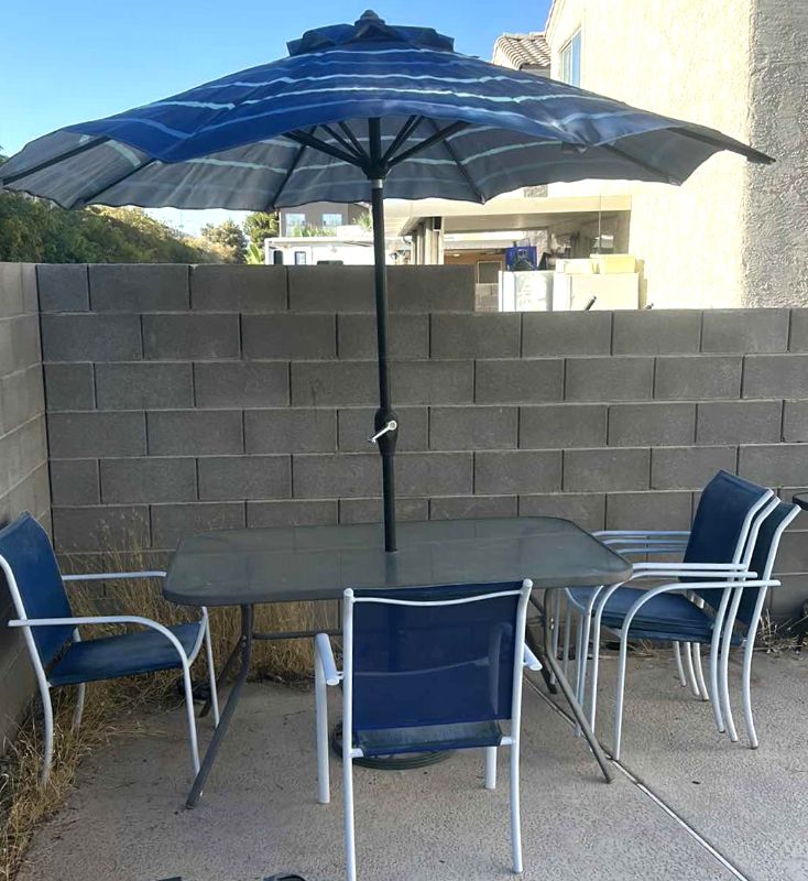 Photo 1 of PATIO TABLE AND 5 CHAIRS W UMBRELLA