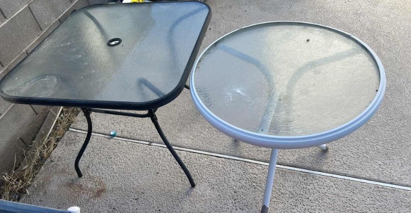Photo 1 of TWO OUTDOOR TABLES, UMBRELLA (NEEDS LOWER POLE) AND WATERING JUG