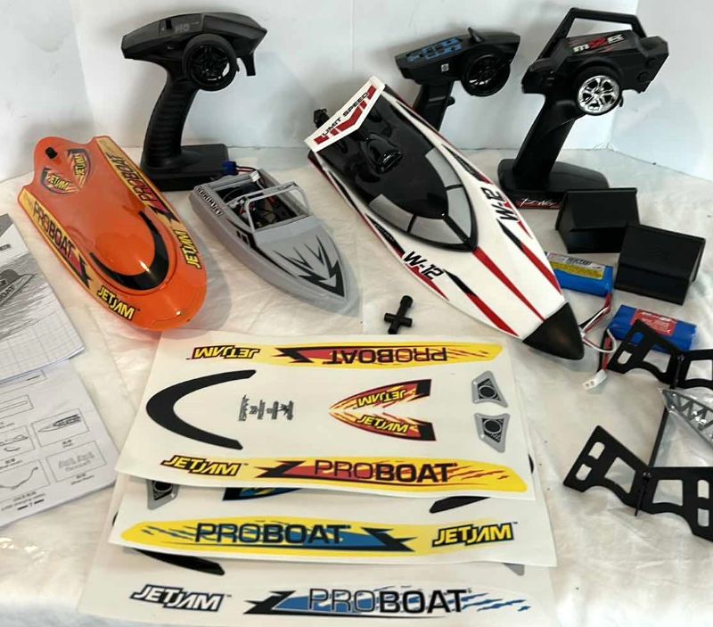 Photo 1 of REMOTE CONTROL POWER BOAT ASSORTMENT WITH BATTERIES AND ACCESSORIES