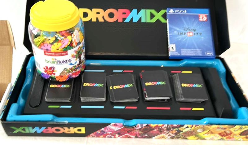 Photo 1 of 3 CHILDRENS GAMES-  PS4, DROPMIX MUSIC MIXING GAME AND BRAIN FLAKES