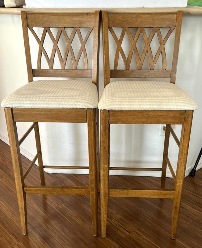 Photo 1 of 2 WOOD BARSTOOLS WITH OFF WHITE TEXTURED FABRIC  
SEATING HEIGHT, 30 1/2" OVERALL HEIGHT 45"