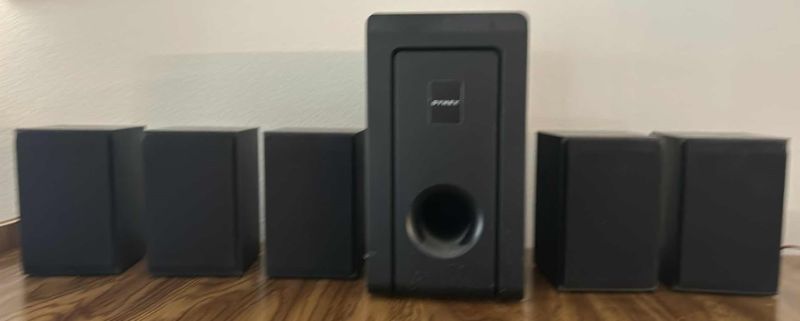 Photo 1 of DYNEX SPEAKER ASSORTMENT - 5 SURROUND SPEAKERS AND 1 SUBWOOFER SPEAKER