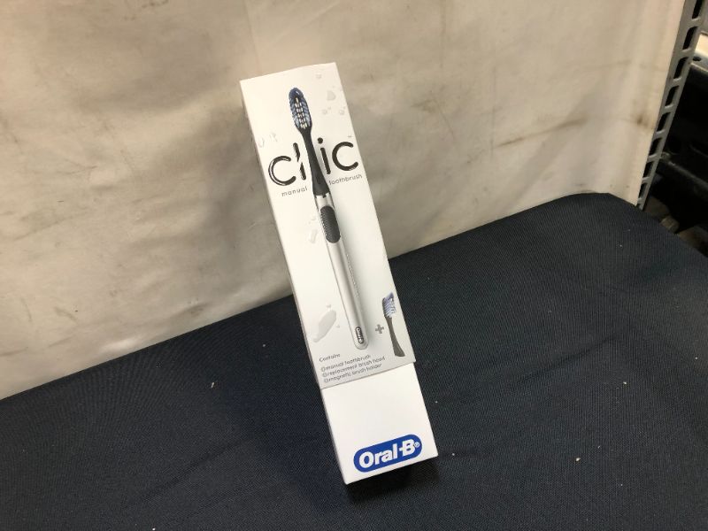 Photo 3 of Oral-B Clic Manual Toothbrush, Chrome Black, with 1 Bonus Replacement Brush Head and Magnetic Toothbrush Holder
