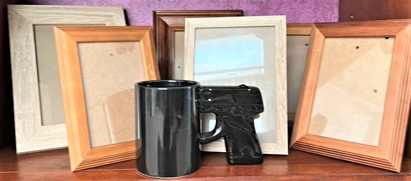 Photo 1 of 6 PICTURE FRAMES AND BLACK PISTOL COFFEE MUG