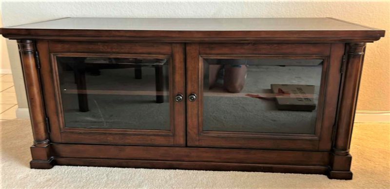 Photo 1 of BASSET WOOD MEDIA CABINET WITH BEVELED GLASS AND COMES WITH REMOVABLE WOOD INSERTS TO CHANGE OUT GLASS. 59” x 24.5” x H26”