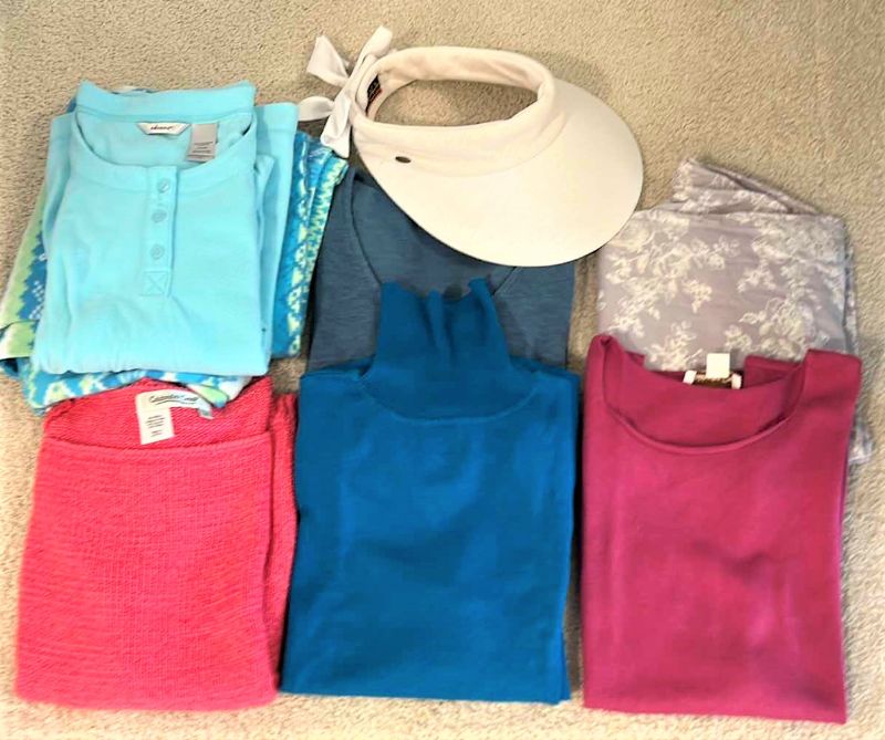 Photo 1 of CLOTHING ASSORTMENT AND SUN HAT