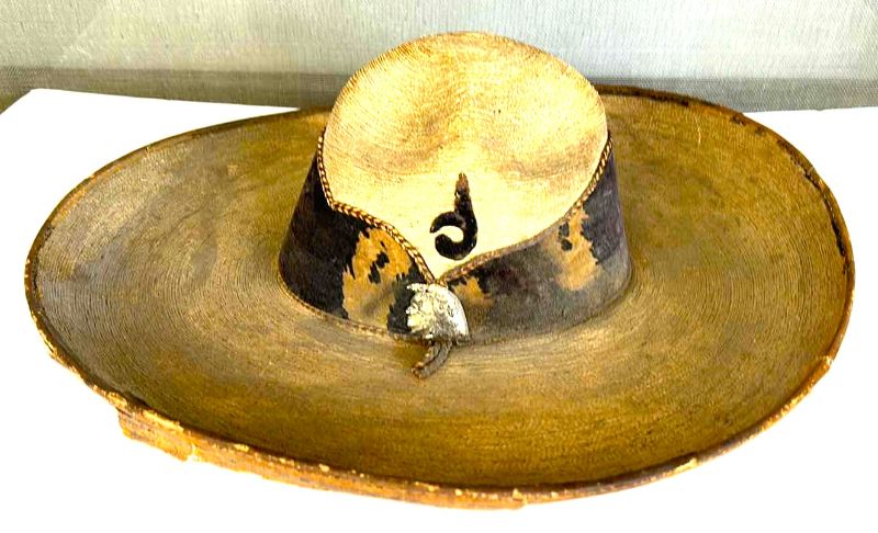 Photo 1 of VINTAGE SOMBRERO WITH LEATHER BAND AND SILVER INDIANS.