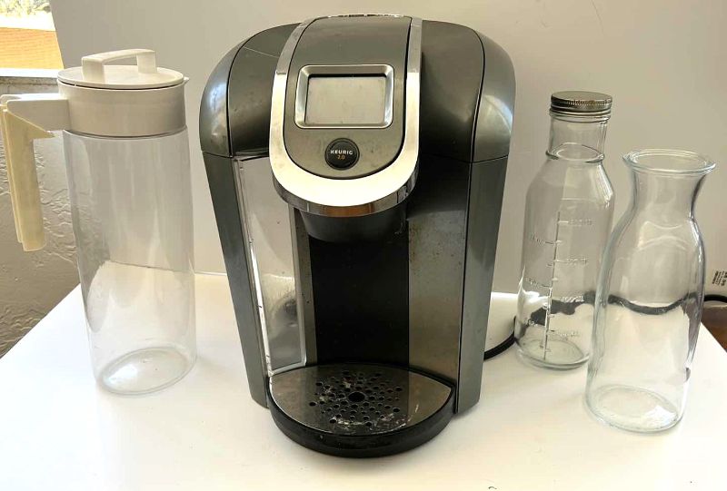 Photo 1 of KEURIG COFFEE MAKER AND 3 GLASS JARS