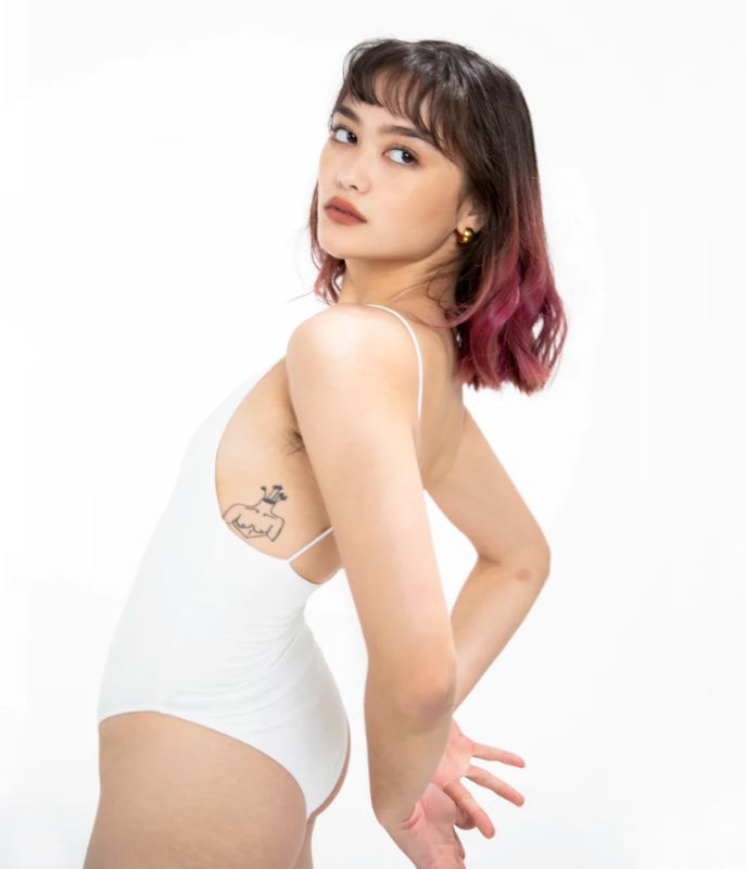 Photo 5 of SIZE X-SMALL AMIRA WHITE BODYSUIT FEATURES ROUND NECKLINE STRAPS AND HI-CUT LEGS. ULTRA SOFTCOTTON LINING FOR PEAK COMFORT.