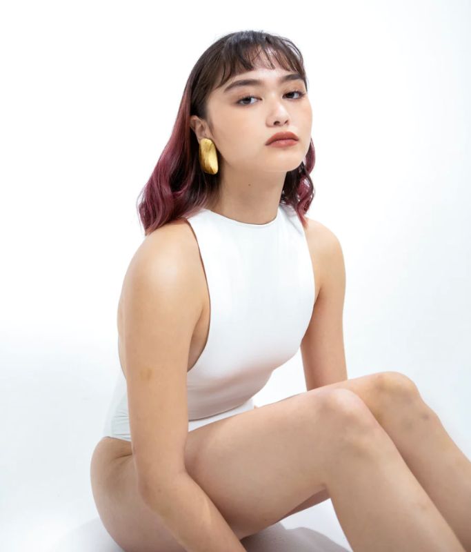 Photo 4 of SIZE X-SMALL WHITE EUNICE BODYSUIT FEATURES A BOAT NECK LINE WITH HIGH COURT LEGS AND A LOW CUT ON SIDES THAT GIVE YOU AM EDGY LOOK.