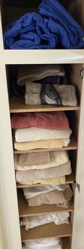 Photo 1 of CONTENTS DOWNSTAIRS LINEN CABINET TOWELS QUEEN BEDDING HEATING PADS