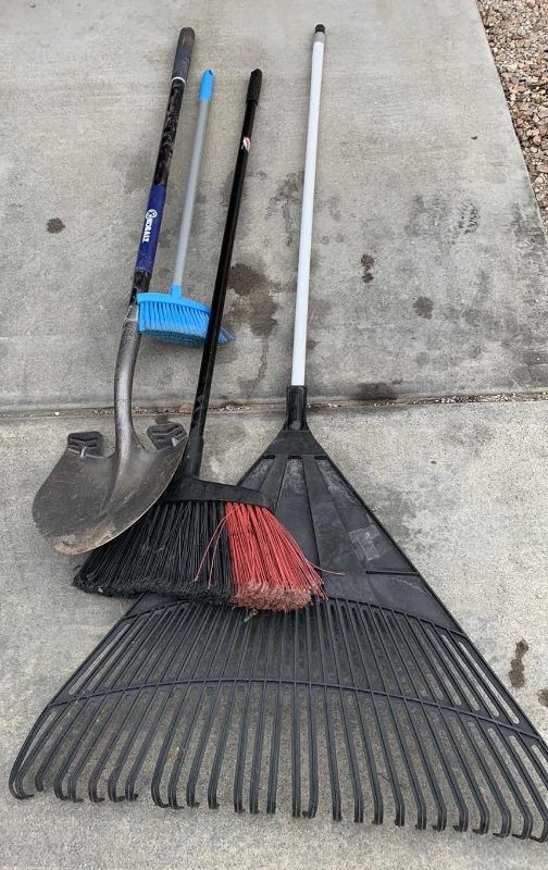 Photo 1 of KOBALT SHOVEL AND BROOMS AND A RAKE