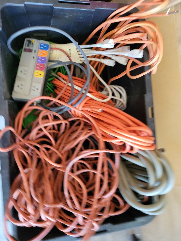 Photo 1 of LARGE TOTE FULL OF VERY LONG EXTENSION CORDS, PIWER STRIPS, TUBING, AND ROMEX