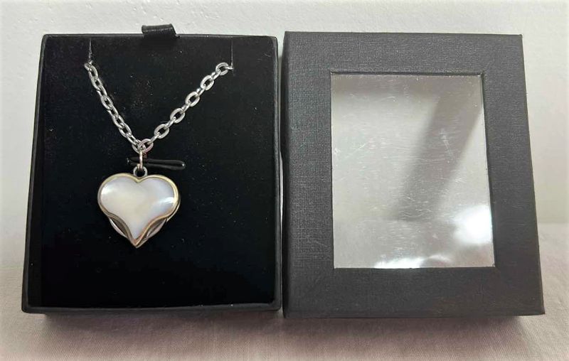 Photo 1 of SHELL HEART PENDANT NECKLACE W POP OUT SMALL CUTICLE KNIVES