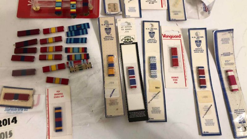 Photo 1 of ASSORTED MILITARY INSIGNIA