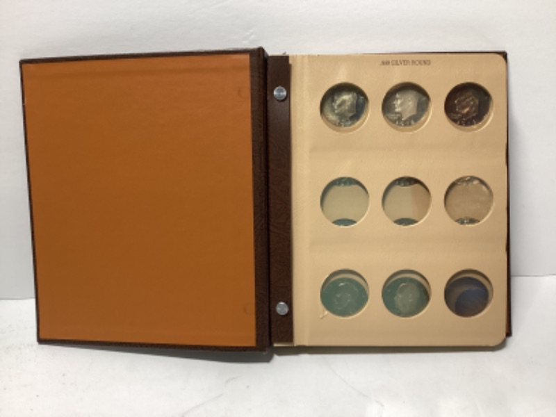 Photo 1 of UNCIRCULATED EISENHOWER DOLLAR COIN SET 1971-1978