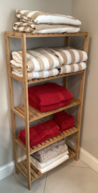 Photo 2 of WOODEN SLATTED SHELF w/ COLLECTION OF TOWELS 