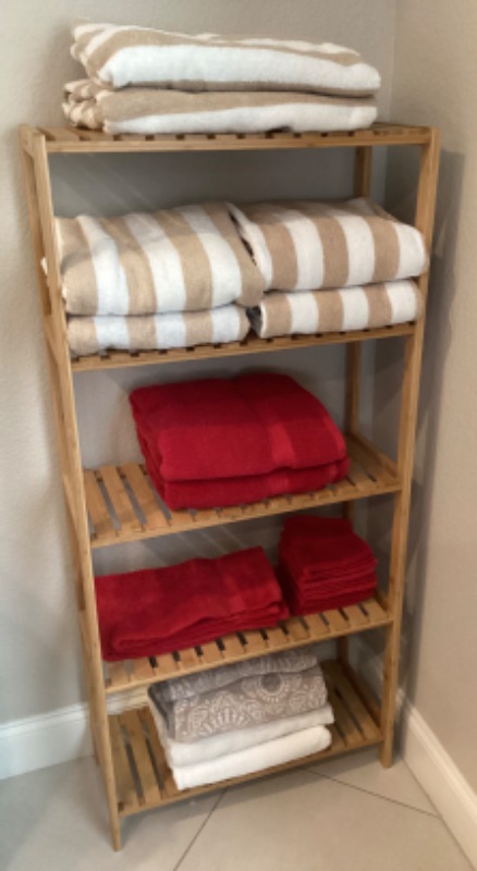 Photo 1 of WOODEN SLATTED SHELF w/ COLLECTION OF TOWELS 