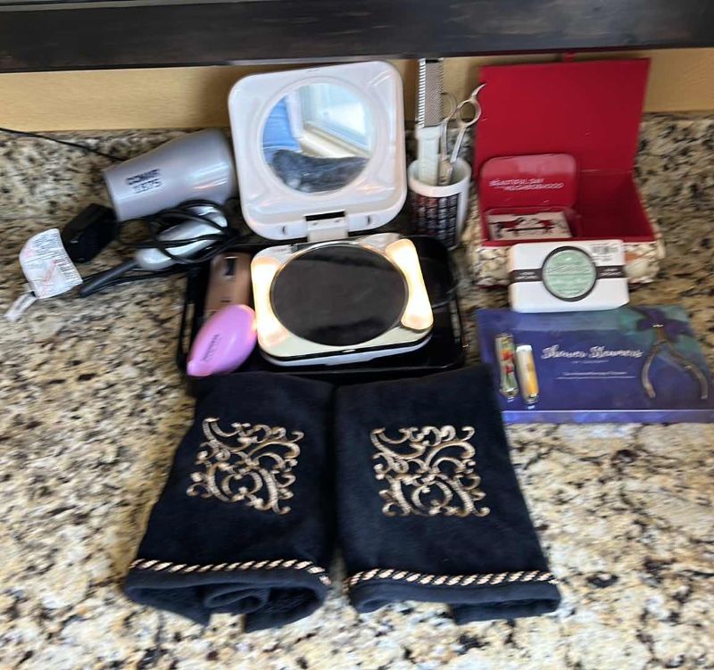 Photo 1 of WOMENS BEAUTY ASSORTMENT- LIGHTED TRAVEL MIRROR, HAIR DRYER, TWEEZERMAN, NO NO HAIR, SOAPS AND MORE