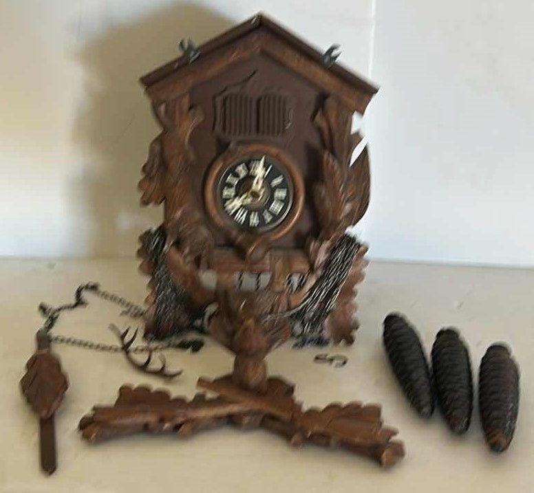Photo 1 of VINTAGE COO COO CLOCK ( NEEDS GLUING) IN WICKER BASKET