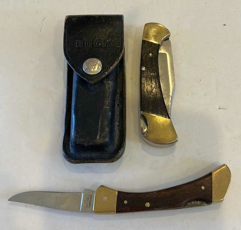 Photo 1 of TWO BUCK KNIVES (ONE WITH CASE)