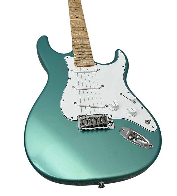 Photo 1 of CARVIN BOLT TEAL METALLIC MAPLE NECK ELECTRIC GUITAR W THE BEATLES/ TEAL STRAPS & CARVIN HARD CASE