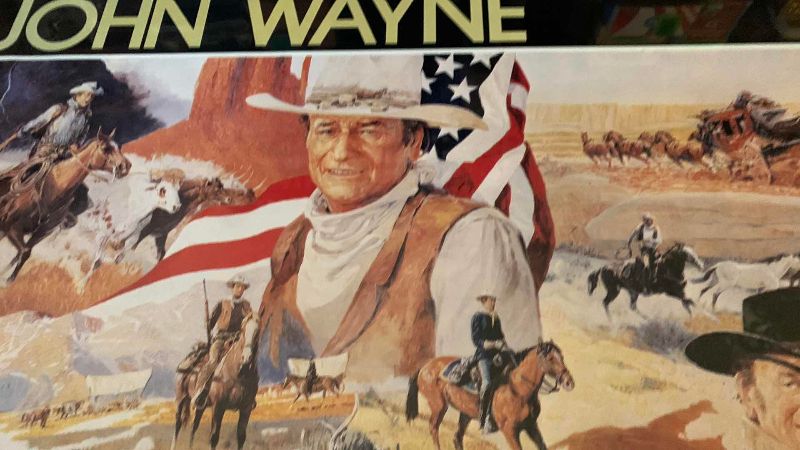 Photo 2 of  WINCHESTER JOHN WAYNE COMMEMORATIVE RIFLE AND AMMO PRINT 24” X 30”