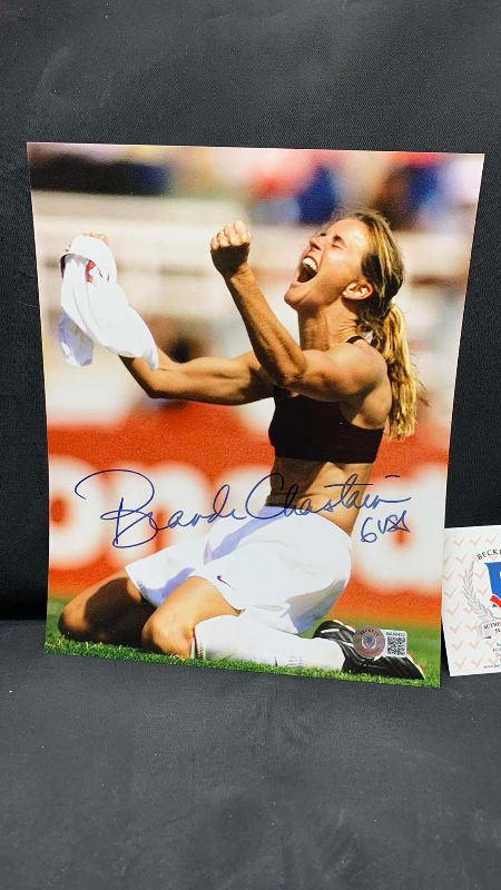 Photo 2 of BRANDI CHASTAIN  - SIGNED AUTOGRAPHED PHOTO W LETTER OF AUTHENTICITY BY BECKETT 8” X 10”