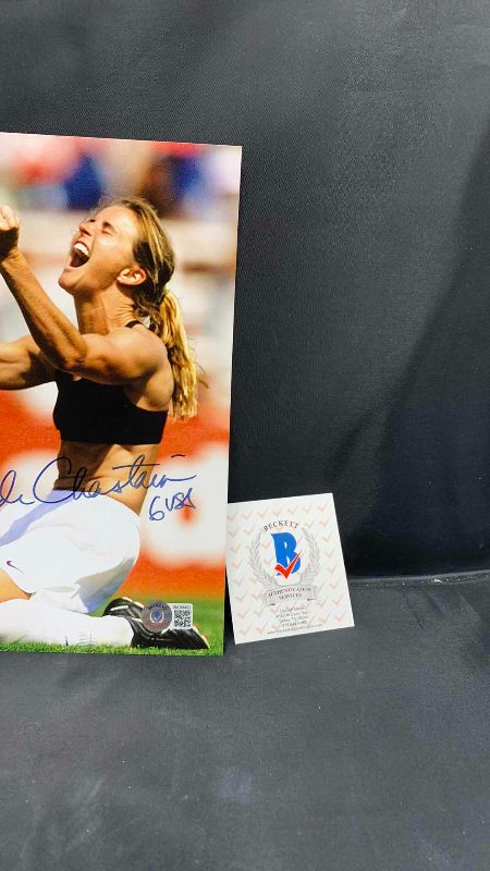 Photo 3 of BRANDI CHASTAIN  - SIGNED AUTOGRAPHED PHOTO W LETTER OF AUTHENTICITY BY BECKETT 8” X 10”