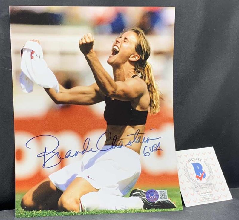 Photo 1 of BRANDI CHASTAIN  - SIGNED AUTOGRAPHED PHOTO W LETTER OF AUTHENTICITY BY BECKETT 8” X 10”