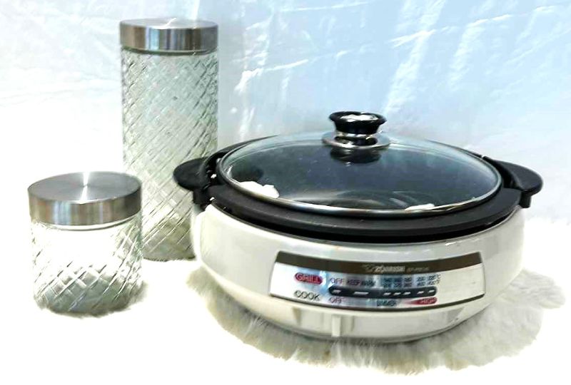 Photo 2 of KITCHEN ACCESSORIES - 2 GLASS CANISTERS AND ZOJIRUSHI GRILL