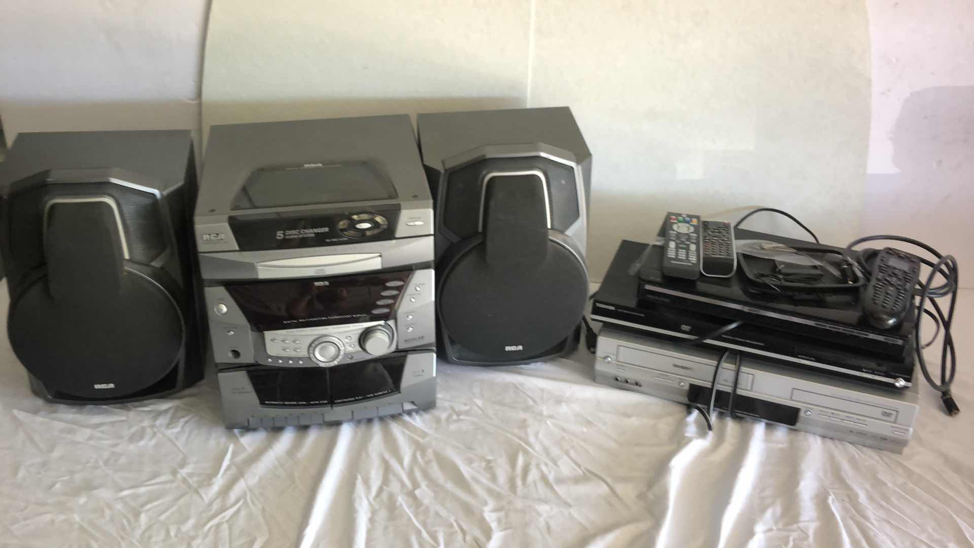 Photo 2 of ENTERTAINMENT BUNDLE RCA RS-255KM AUDIO SYSTEM, DVD AND VHS PLAYERS W REMOTES, STAR TREK VHS SETS