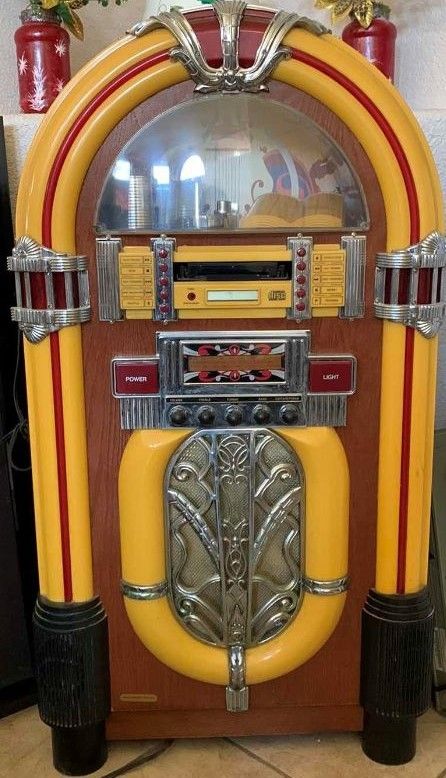 Photo 1 of ELECTRONIC JUKEBOX WITH RADIO AND DISC SLOT 22” X 11” H 39”