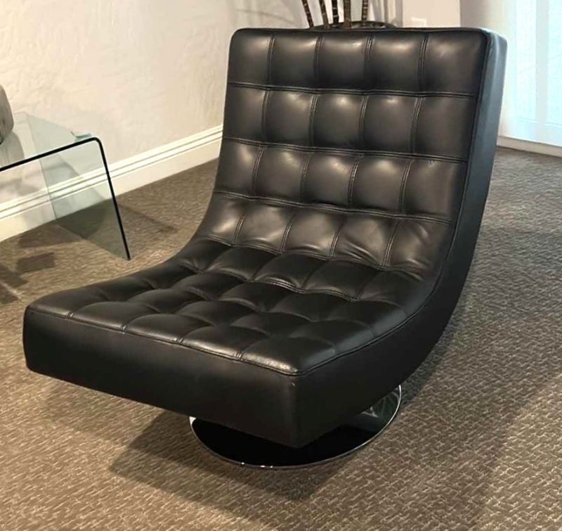 Photo 1 of ROCHE BOBLOIS BLACK LEATHER SWIVEL ARMLESS CHAIR W POLISHED STAINLESS-STEEL BASE