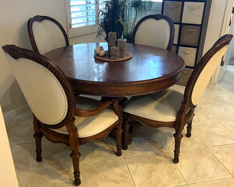 Photo 1 of HEAVY CARVED WALNUT WOOD 48" ROUND DINING TABLE W. 2 ARM CHAIRS & 2 SIDE CHAIRS-INCLUDES 2-12" WIDE TABLE EXTENSIONS (FULLY EXTENDED TO 72")-OFF WHITE PADDED FABRIC CHAIRS