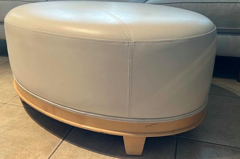 Photo 1 of CREAM COLOR LEATHER OVAL OTTOMAN