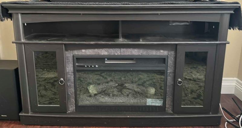 Photo 1 of BLACK WOOD ENTERTAINMENT STAND WITH FIRE PLACE - 59” x 46.5” x 34.5”