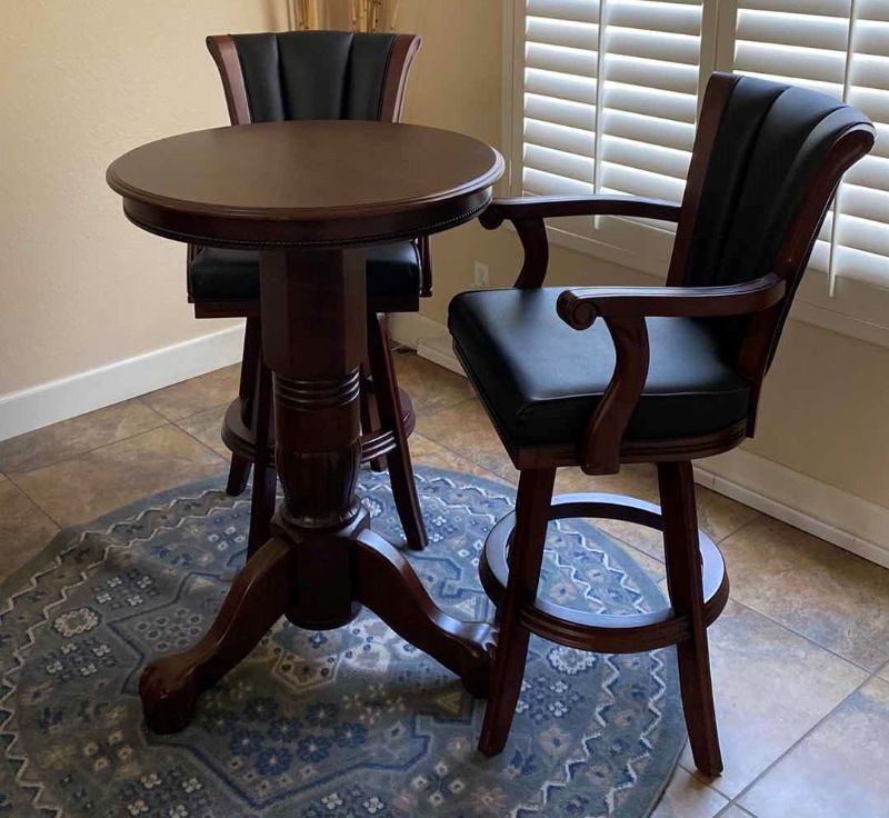 Photo 1 of ROUND WOOD TABLE W 2 SWIVEL LEATHER W WOOD BAR STOOL CHAIRS