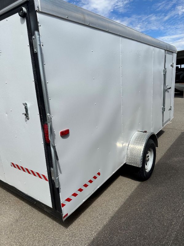 Photo 3 of 6' x 14' WHITE METAL ENCLOSED 2010 CARGO TRAILER W RAMP BACK GATE, SIDE DOOR. TIRES EXCELLENT CONDITION (SPARE TIRE INCLUDED) INTERIOR HEIGHT 75" - CLEAR TITLE
