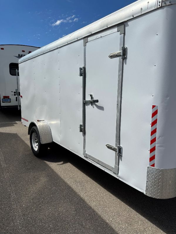 Photo 2 of 6' x 14' WHITE METAL ENCLOSED 2010 CARGO TRAILER W RAMP BACK GATE, SIDE DOOR. TIRES EXCELLENT CONDITION (SPARE TIRE INCLUDED) INTERIOR HEIGHT 75" - CLEAR TITLE
