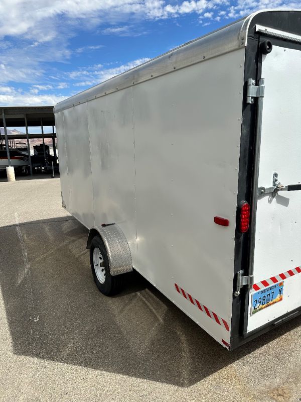 Photo 6 of 6' x 14' WHITE METAL ENCLOSED 2010 CARGO TRAILER W RAMP BACK GATE, SIDE DOOR. TIRES EXCELLENT CONDITION (SPARE TIRE INCLUDED) INTERIOR HEIGHT 75" - CLEAR TITLE