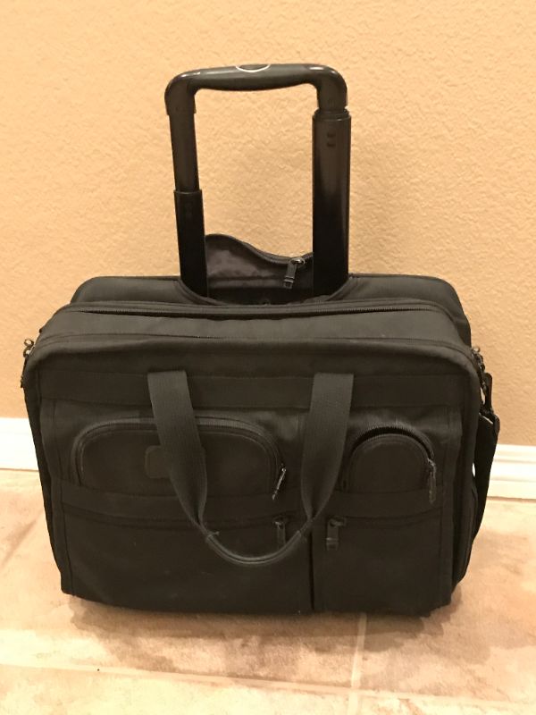 Photo 1 of TUMI ALPHA DELUXE 4 WHEELED LAPTOP CASE BRIEF