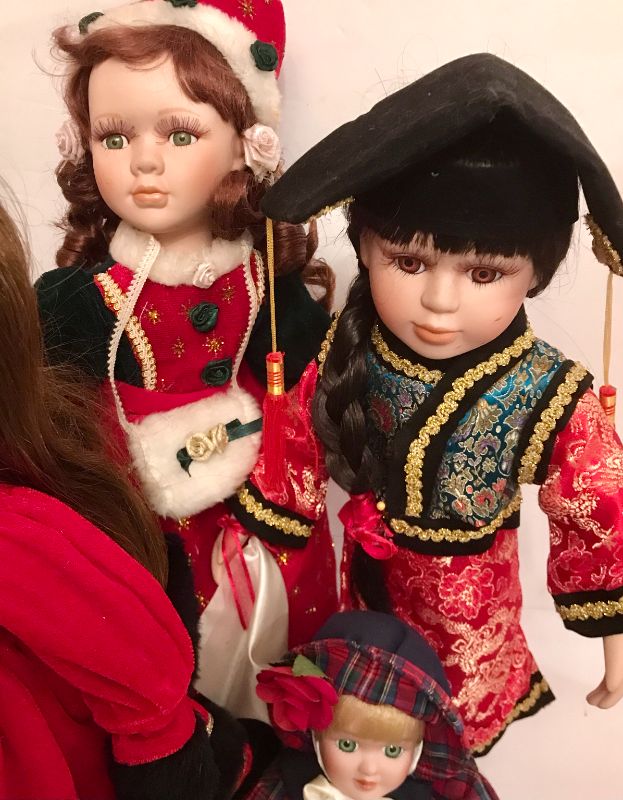 Photo 2 of COLLECTION OF PORCELAIN DOLLS IN DIFFERENT ATTIRE