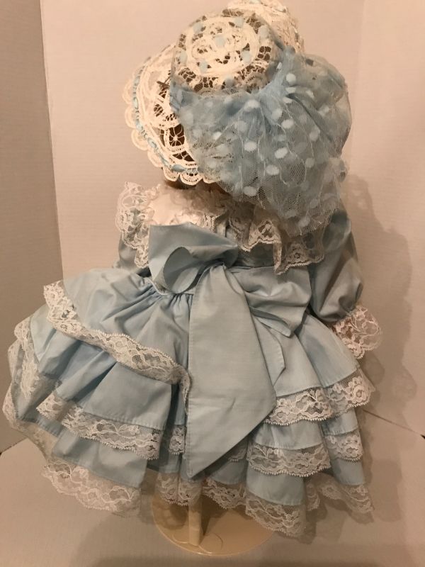 Photo 2 of VINTAGE 24" PORCELAIN DOLL 