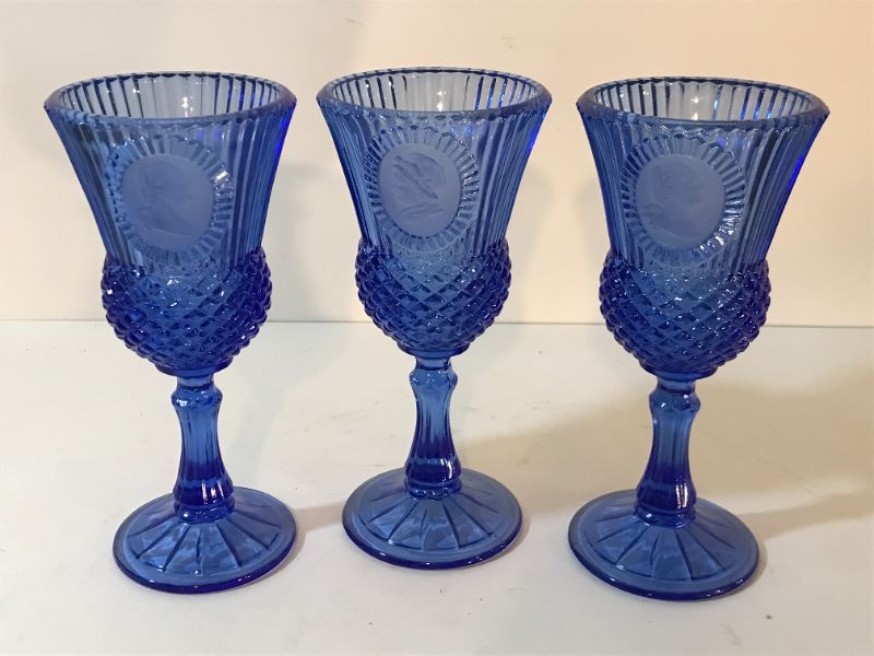 Photo 2 of AVON FOSTORIA BLUE WATER GLASS GOBLETS WITH CAMEO OF GEORGE AND MARTHA WASHINGTON FACE ON SIDE CANDLE HOLDER 1976