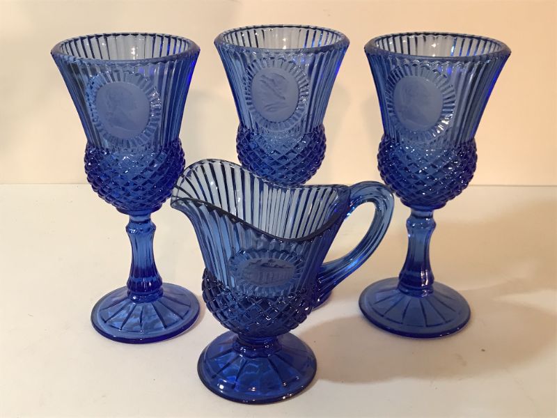 Photo 1 of AVON FOSTORIA BLUE WATER GLASS GOBLETS WITH CAMEO OF GEORGE AND MARTHA WASHINGTON FACE ON SIDE CANDLE HOLDER 1976