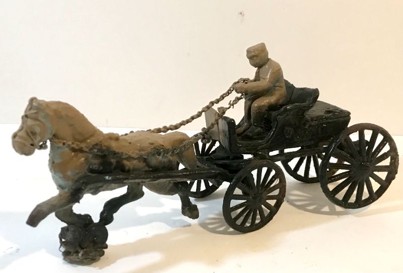 Photo 1 of ANTIQUE CAST IRON HORSE DRAWN CARRIAGE 
APROX 14”L